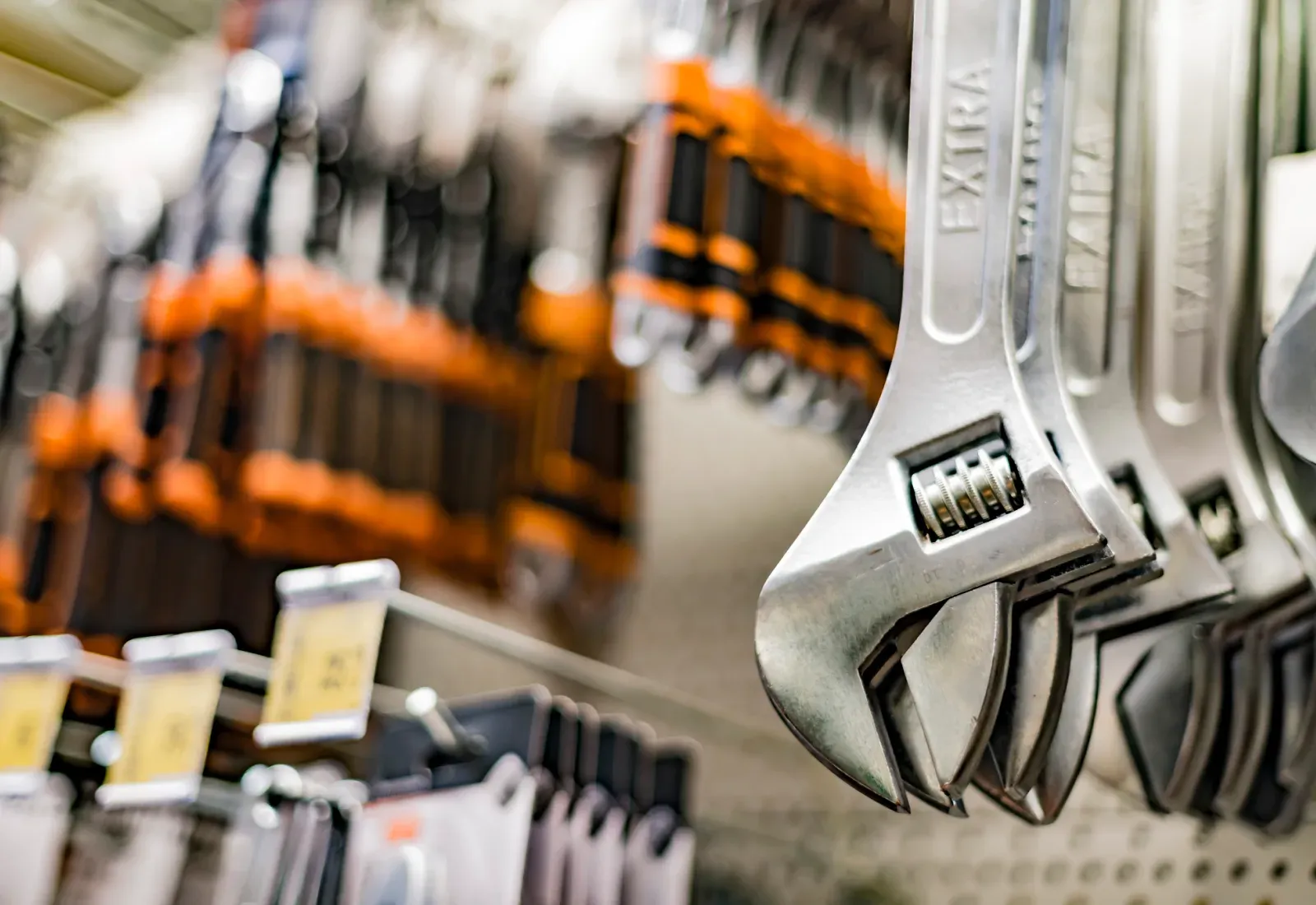 Spanners and tools hanging in a DIY aisle.
